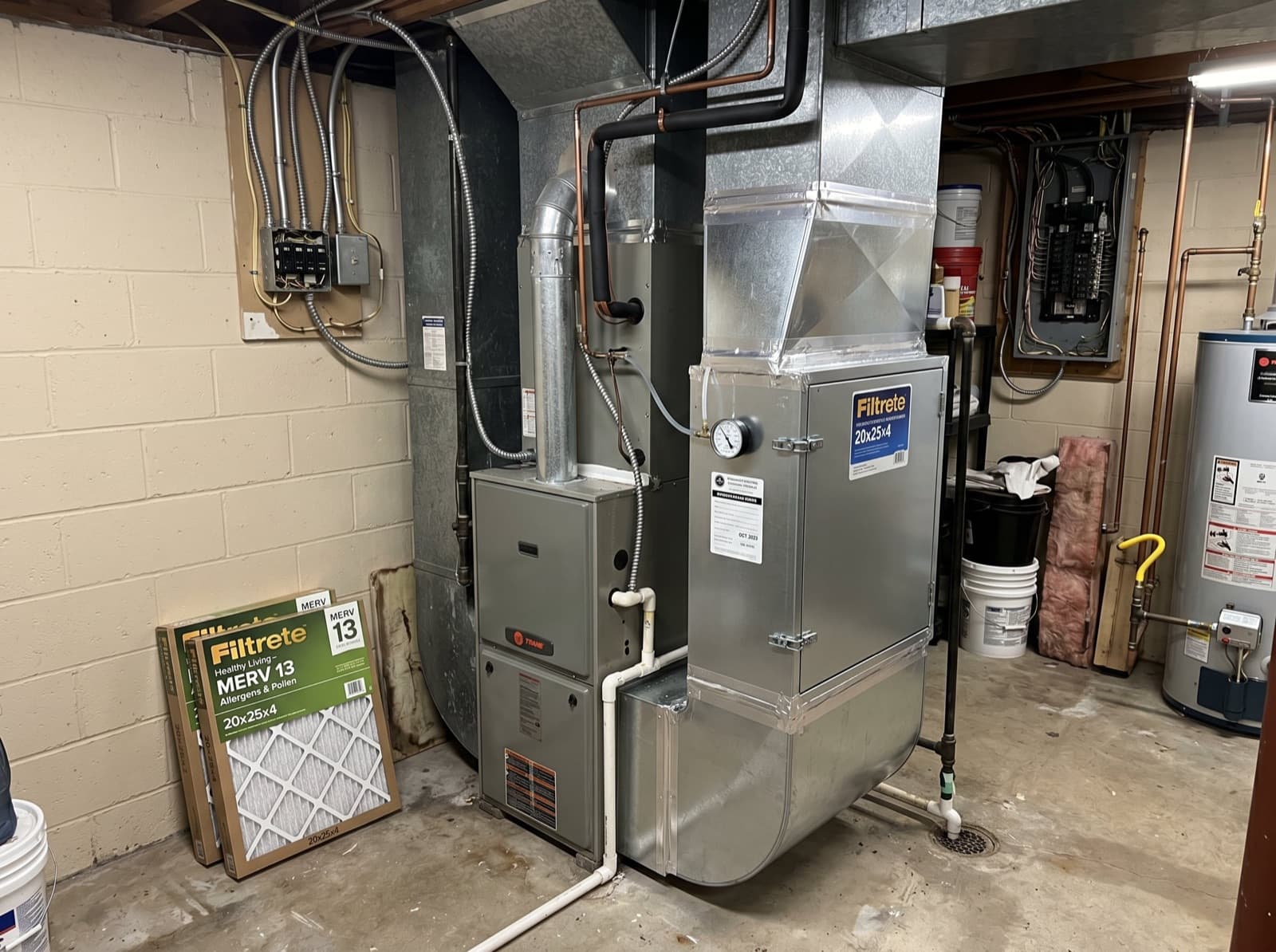 Indoor air quality filter cabinet attached to a furnace.