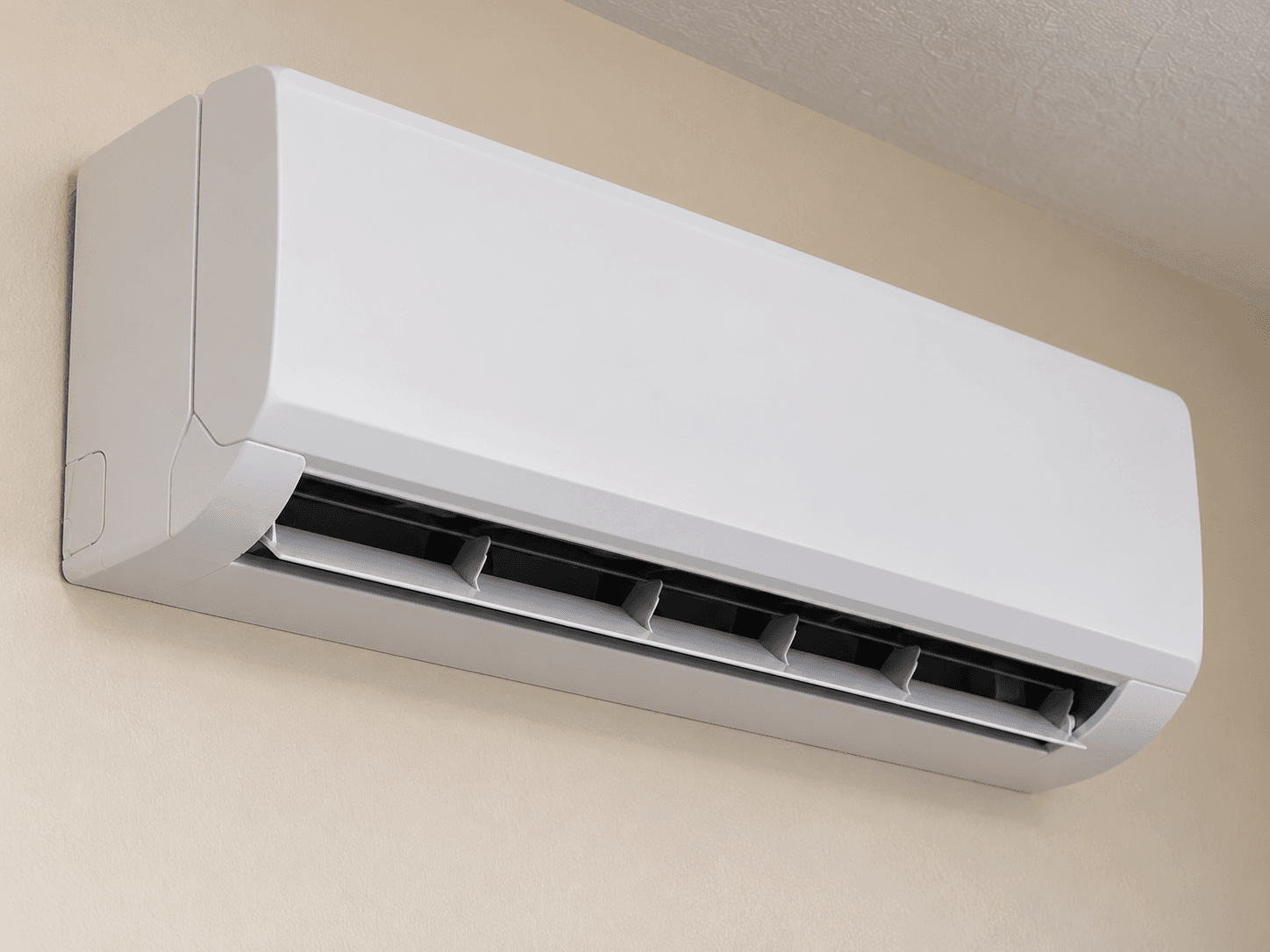 The lower outlet vane is visible beneath a closed ductless front cover.