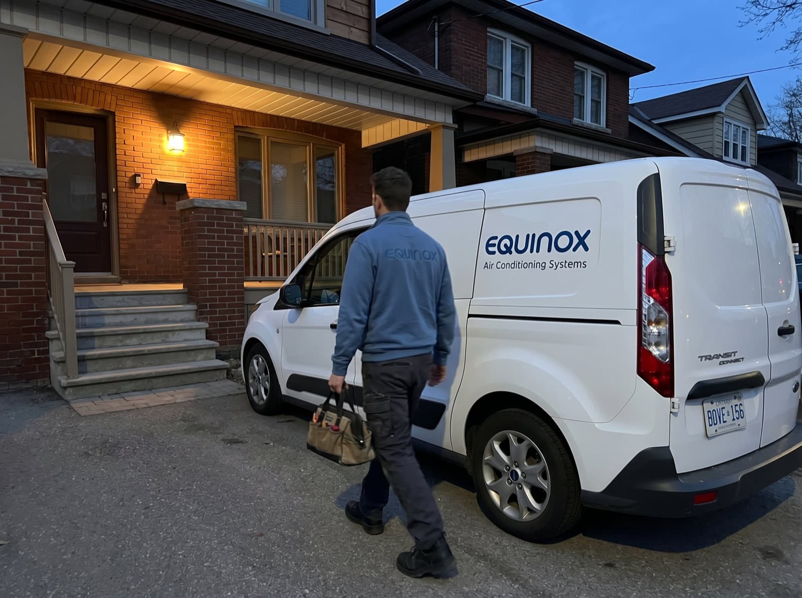 Equinox technician arriving at a Toronto driveway with the service van.